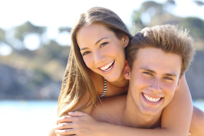 Happy,Couple,With,Perfect,Smile,And,White,Teeth,Posing,On